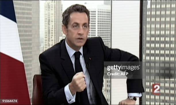 This Tv grab taken from French TV channel France 2 shows French president Nicolas Sarkozy answering to journalists Laurence Ferrari and David...