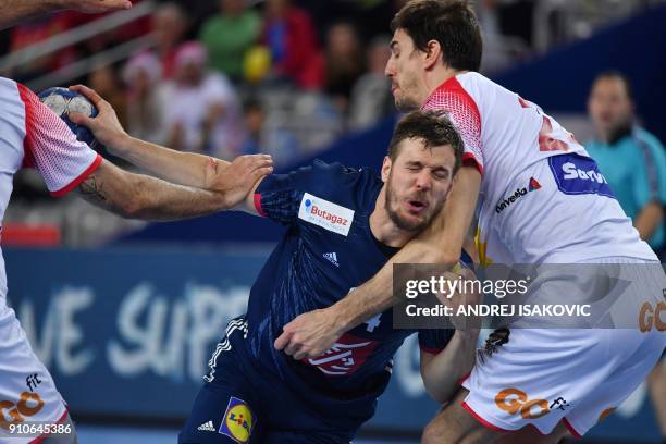 France's Kentin Mahe vies with Spain's Viran Morros de Argila during the semi-final match of the Men's 2018 EHF European Handball Championship...