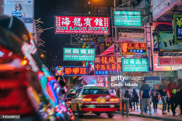 colorful neon night street road in hongkong with taxi - hongkong street stock pictures, royalty-free photos & images