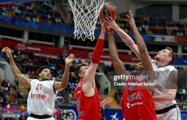 Andrey Vorontsevich, #20 and Kyle Hines, #42 of CSKA Moscow competes with Leon Radosevic, #43 and Augustine Rubit, #21 of Brose Bamberg in action...