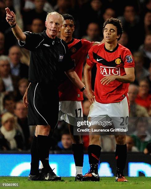 Fabio Da Silva of Manchester United is sent off by Referee Peter Walton during the Carling Cup Third Round match between Manchester United and...