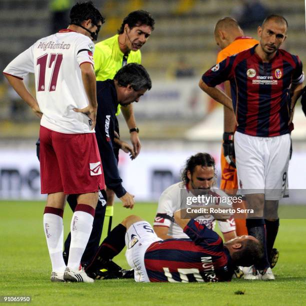 Massimo Mutarelli of Bologna lies injured after clashing with Davide Marchini of Livorno during the Serie A match between Bologna FC and AS Livorno...