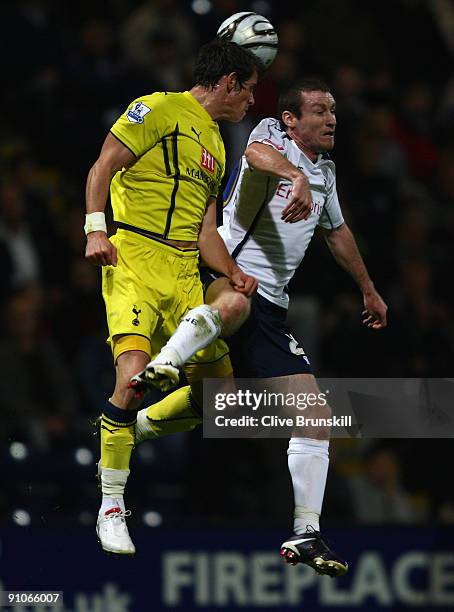 Steve Elliott of Preston North End goes up for a header with Gareth Bale of Tottenham Hotspur during the Carling Cup Third round match between...