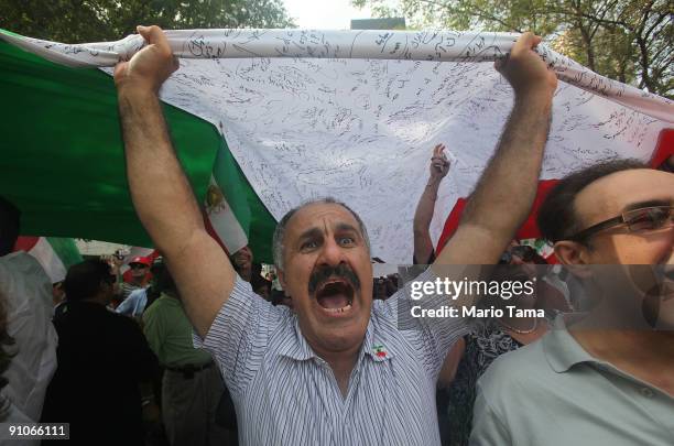 Protesters of Iranian President Mahmoud Ahmadinejad demonstrate outside U.N. Headquarters on the first day of the United Nations General Assembly...