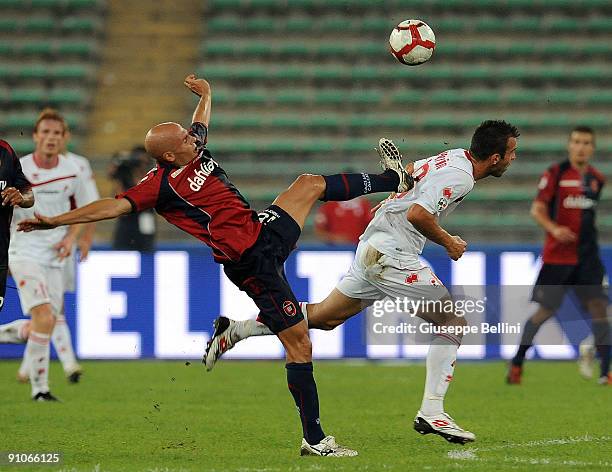 Andrea Parola of Cagliari Calcio and Riccardo Maggiorini AS Bari compete for the ball during the Serie A match between Bari and Cagliari at Stadio...