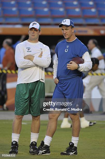 Quarterbacks Peyton Manning of the Indianapolis Colts and Chad Pennington of the Miami Dolphins talk prior to a NFL game against the Miami Dolphins...