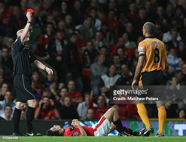 Fabio Da Silva of Manchester United is sent off by referee Peter Walton during the Carling Cup Third Round match between Manchester United and...