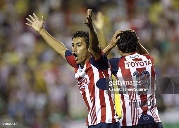 Alberto Medina and Jonny Magallon of Chivas de Guadalajara react after a goal was called back during the Mexican First Division 'Clásico Nacional'...