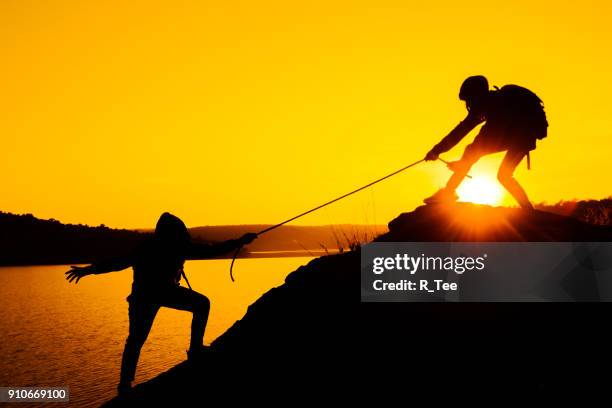 Friends Rope Pull Pulling Rope Silhouette Photos and Premium High Res Pictures - Getty Images