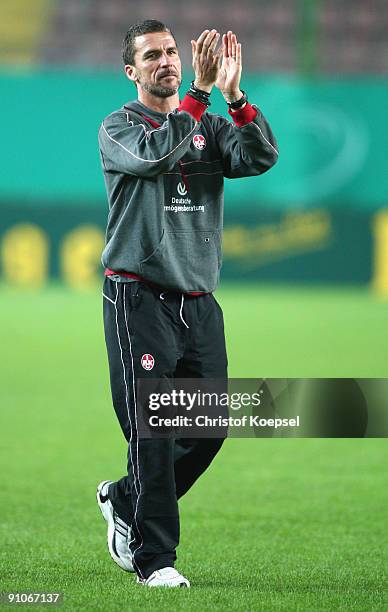 Head coach Marco Kurz of Kaiserslautern celebrates the 2-1 victory with the fans after the DFB Cup second round match between 1. FC Kaiserslautern...