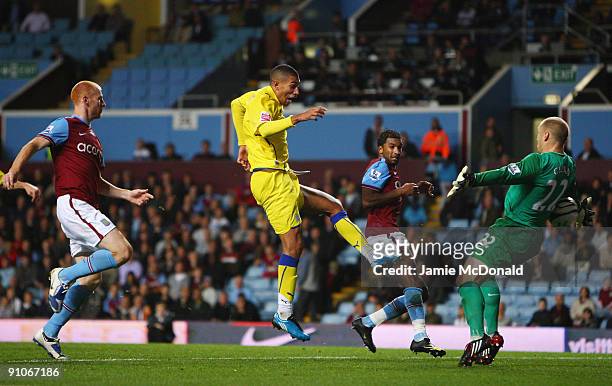 Jay Bothroyd of Cardiff City beats Brad Guzan of Aston Villa to score a goal but it is over-ruled because of an off-side disision during the Carling...