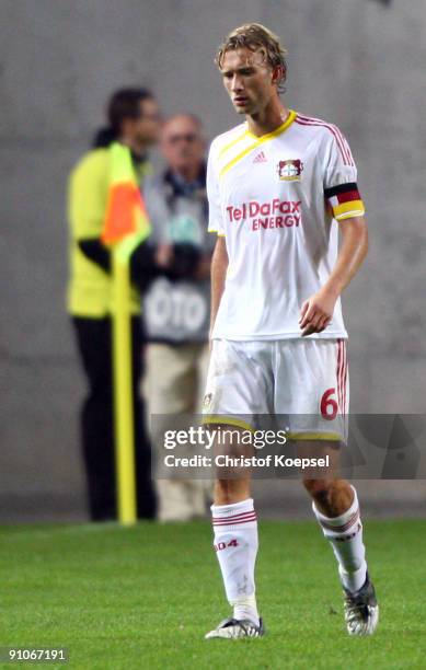 Simon Rolfes of Leverkusen looks dejected after losing 1-2 the DFB Cup second round match between 1. FC Kaiserslautern and Bayer Leverkusen at...