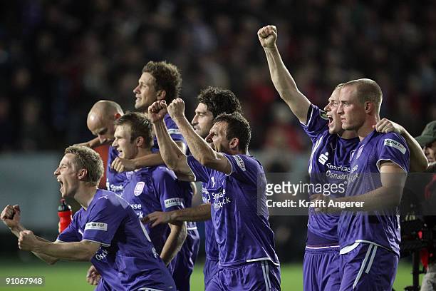The team of Osnabrueck celebrates winning the DFB Cup second round match between VfL Osnabrueck and Hamburg SV at Osnatel Arena on September 23, 2009...