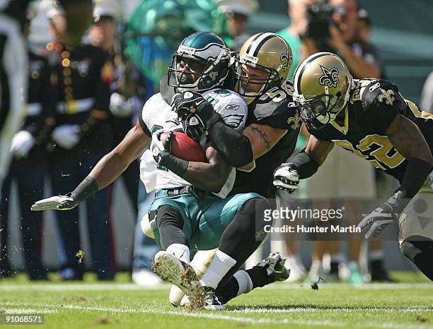 Linebacker Scott Shanle of the New Orleans Saints makes a tackle during a game against the Philadelphia Eagles on September 20, 2009 at Lincoln...