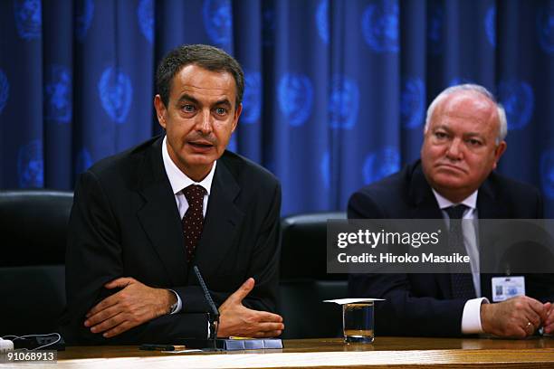Spanish Prime Minister Jose Luis Zapatero talks to the media during a press conference as Spanish Foregin Affairs Minister Miguel Angel Moratinos...