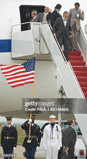 Honor Guard stands at attention to welcome Saudi Foreign Minister Saud al-Faisal as he walks down the steps of his official jet after landing at...