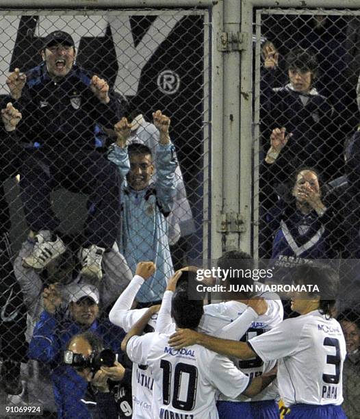 Argentina's Velez Sarsfield players celebrate with fans after scoring against Chile's Union Espanola during their 2009 Copa Sudamericana football...