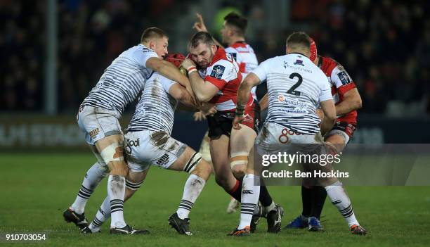 Fraser Balmain of Gloucester is tackled by Morgan Morris of Ospreys during the Anglo-Welsh Cup match between Gloucester Rugby and Ospreys at...