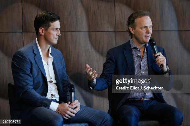 Former Tampa Bay Lightning player Vincent Lecavalier speaks on stage with Tampa Bay Lightning head coach Jon Cooper at the podium during NHL All-Star...