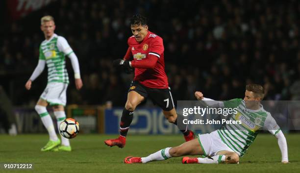 Alexis Sanchez of Manchester United in action with Jared Bird of Yeovil Town during the Emirates FA Cup Fourth Round match between Yeovil Town and...