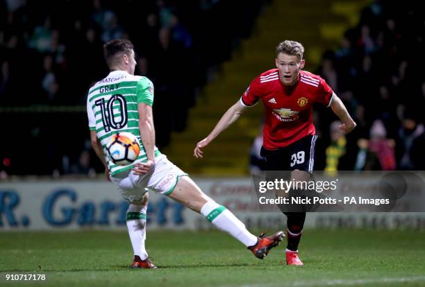 Manchester United's Scott McTominay and Yeovil Town's Jake Gray battle for the ball during the Emirates FA Cup, fourth round match at Huish Park,...