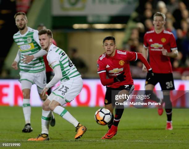 Alexis Sanchez of Manchester United in action with Tom James of Yeovil Town during the Emirates FA Cup Fourth Round match between Yeovil Town and...