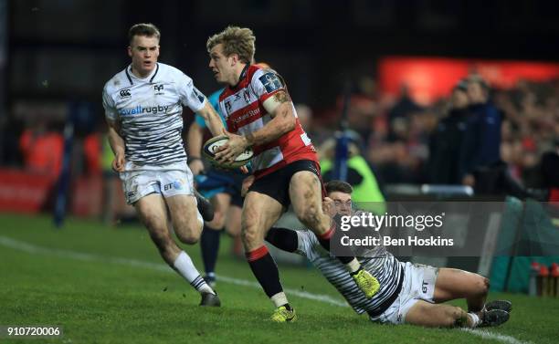 Ollie Thorley of Gloucester is tackled by Reuben Morgan-Williams of Ospreys during the Anglo-Welsh Cup match between Gloucester Rugby and Ospreys at...