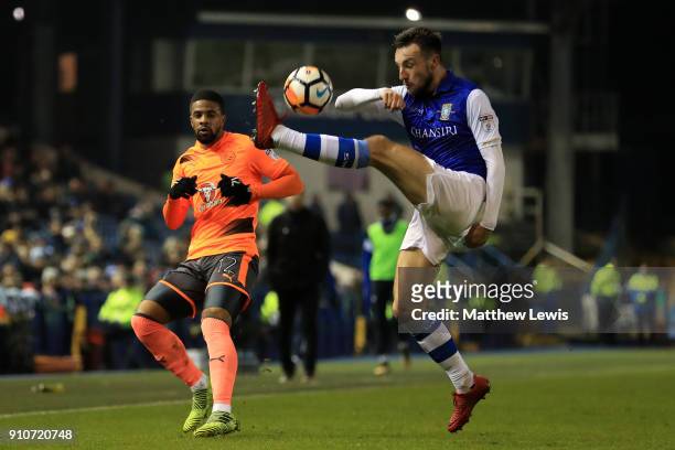 Garath McCleary of Reading and Morgan Fox of Sheffield Wednesday in action during The Emirates FA Cup Fourth Round match between Sheffield Wednesday...