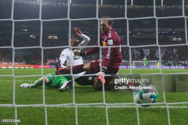 Kevin-Prince Boateng of Frankfurt scores his team's first goal against goalkeeper Tobias Sippel of Moenchengladbach during the Bundesliga match...