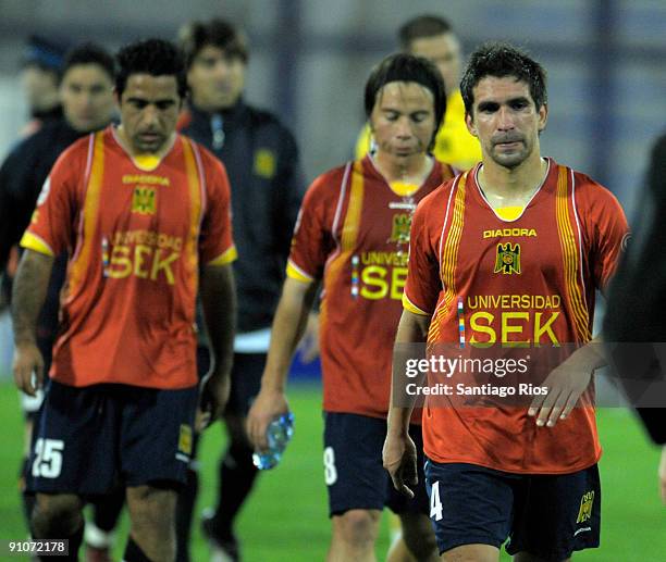 Chile's Union Espanola players, led by Gonzalo Villagra leave the field after losing the match against Argentina's Velez Sarsfield , as part of the...