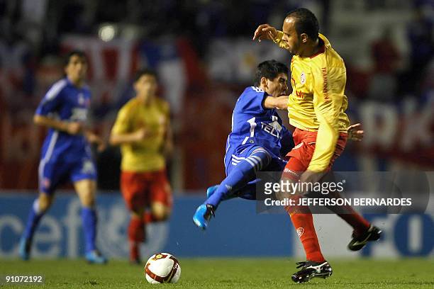 Universidad de Chile´s Mauricio Dansilio vies for the ball with Brazil´s Internacional's Alecsandro during their Copa Sudamericana football match at...