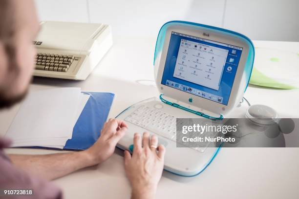 Member of staff shows iBook G3, release date May 2001, with Apple IIe, release date January 1983, on the background, at MacPaw's Ukrainian Apple...