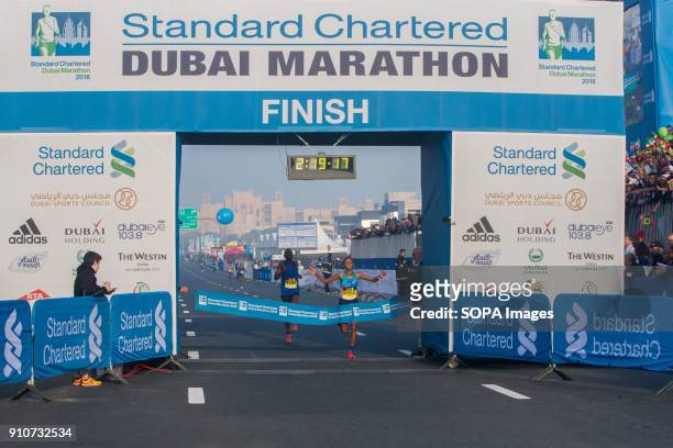 Roza Dereje of Ethiopia crosses the line to win the Standard Chartered Dubai Marathon 2018 in a new course record time of 2:19:17.