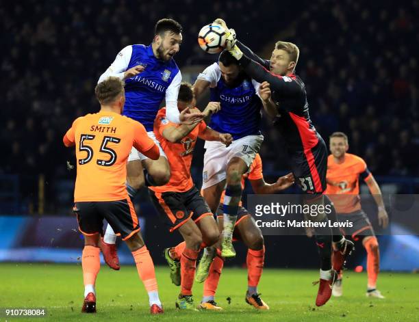 RAnssi Jaakkola of Reading clears from Atdhe Nuhiu of Sheffield Wednesday during The Emirates FA Cup Fourth Round match between Sheffield Wednesday...