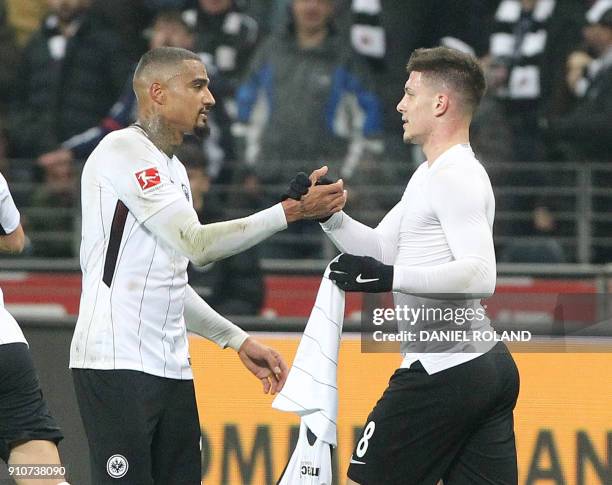 Frankfurt's Serbian forward Luka Jovic celebrates scoring the 2-0 goal with Frankfurt's Ghanaian midfielder Kevin-Prince Boateng during the German...