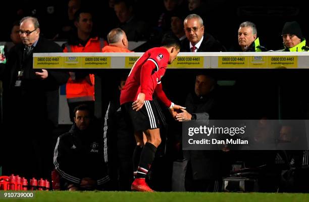 Alexis Sanchez of Manchester United shakes hands with Jose Mourinho, Manager of Manchester United as he is substituted during The Emirates FA Cup...