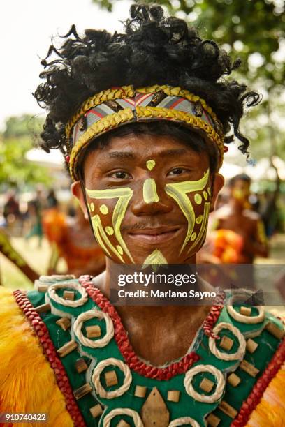 tribesman at festival - dinagyang festival stock pictures, royalty-free photos & images