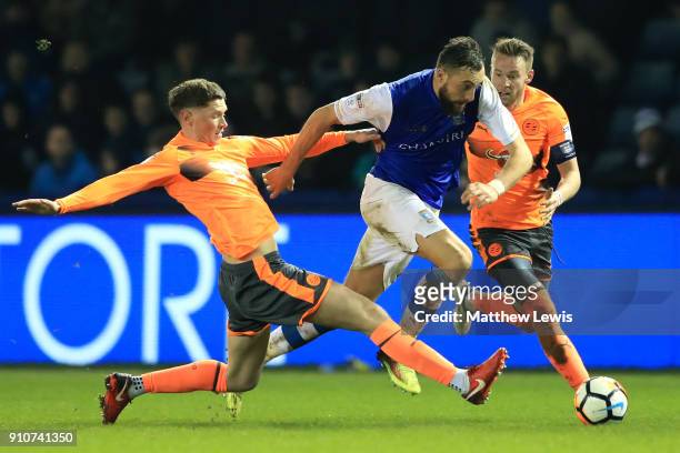 Atdhe Nuhiu of Sheffield Wednesday is tackled by Sam Smith of Reading during The Emirates FA Cup Fourth Round match between Sheffield Wednesday and...