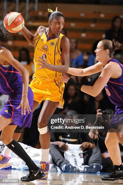 Lisa Leslie of the Los Angeles Sparks controls the ball against Nicole Ohlde of the Phoenix Mercury in Game One of the Western Conference Finals...