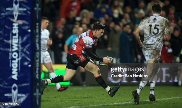 Matt Scott of Gloucester breaks through to score a second half try during the Anglo-Welsh Cup match between Gloucester Rugby and Ospreys at Kingsholm...