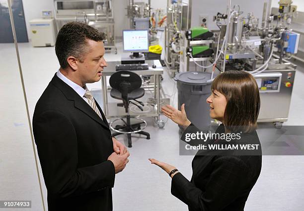 Federal Health Minister Nicola Roxon tours the laboratories of vaccine manufacturer CSL, guided by influenza manufacturing manager Jonah Smith in...
