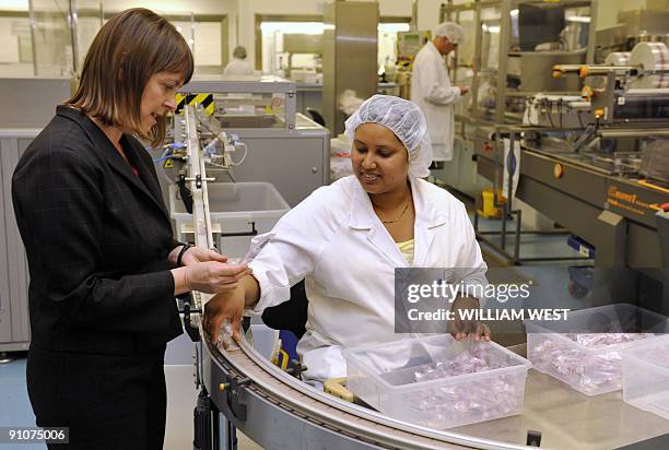 Federal Health Minister Nicola Roxon tours the laboratories of vaccine manufacturer CSL in Melbourne on September 24, 2009 after an 87 million US...