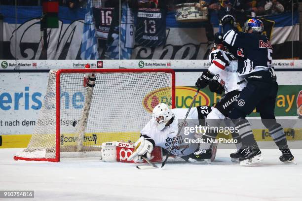 Keith Aulie of Red Bull Munich scores the 2::0 during the 46th game day of the German Ice Hockey League between Red Bull Munich and Koelner Haie in...