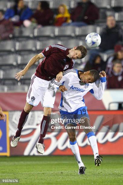 Drew Moor of the Colorado Rapids fights for the ball against Ryan Johnson of the San Jose Earthquakes on September 23, 2009 at Dick's Sporting Goods...