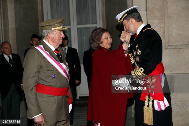 In this handout picture provided by the Spanish Royal House, King Juan carlos, Queen Sofia and King Felipe of Spain are seen during the Military...