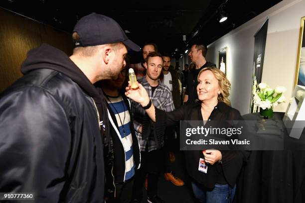 Ryan Tedder, Eddie Fisher, and Zach Filkins of One Republic with CHILD perfume in the MusiCares talent lounge presented by Conagra Brands during the...