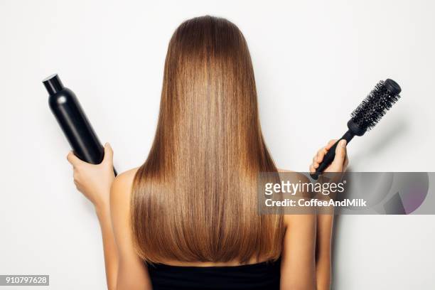 Woman Standing With Her Back And Demonstrates Luxurious Hairstyle High-Res  Stock Photo - Getty Images