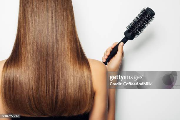 woman standing with her back and demonstrates luxurious hairstyle - hair beauty imagens e fotografias de stock