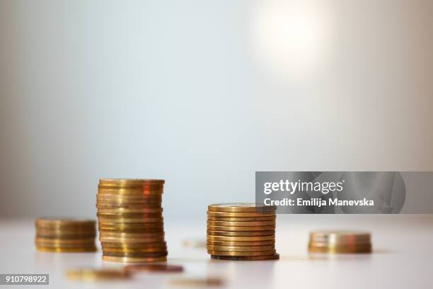 coins currency pile and savings on white background - moeda de dez cents - fotografias e filmes do acervo