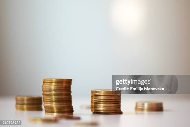 coins currency pile and savings on white background - tiocentsmynt bildbanksfoton och bilder